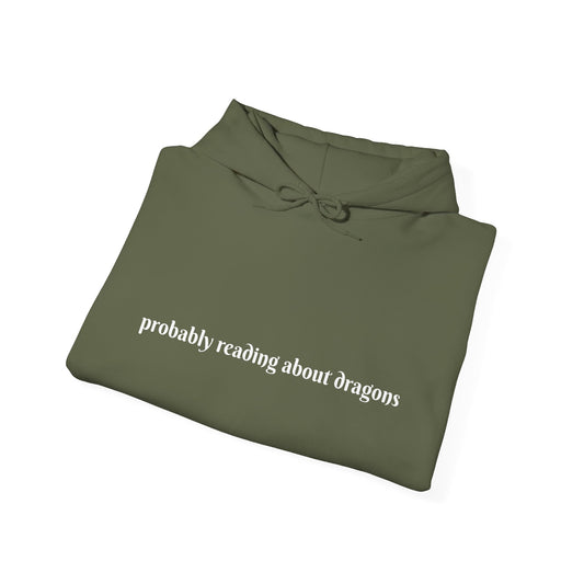 Probably reading about dragons... Hooded Sweatshirt