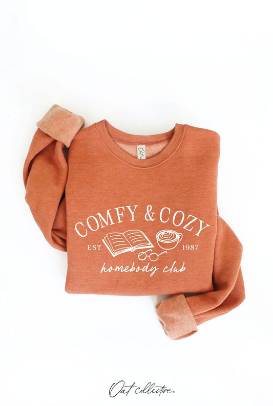 COMFY AND COZY HOMEBODY CLUB Graphic Sweatshirt: HEATHER AUTUMN, M